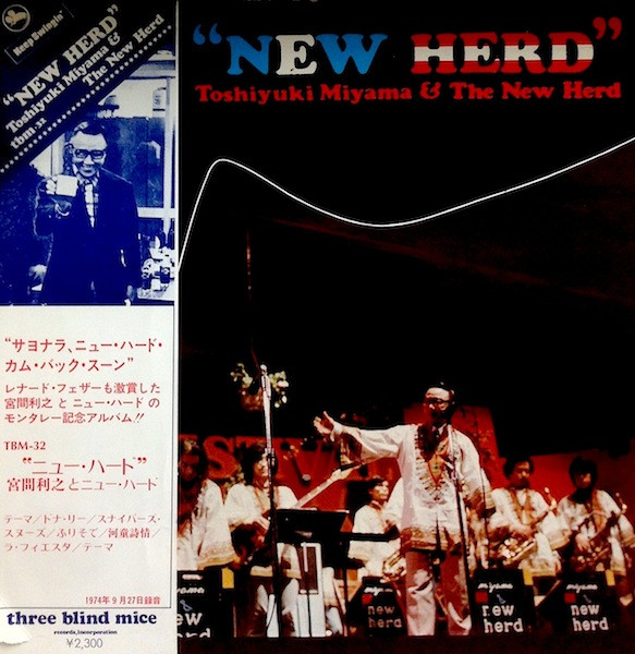 Cover of the Three Blind Mice LP New Herd: Toshiyuki Miyama in a white robe conducting his big band on a dark stage, the title in red, white and blue lettering, with a Japanese obi strip down the left side listing the tracks and the date September 27, 1974